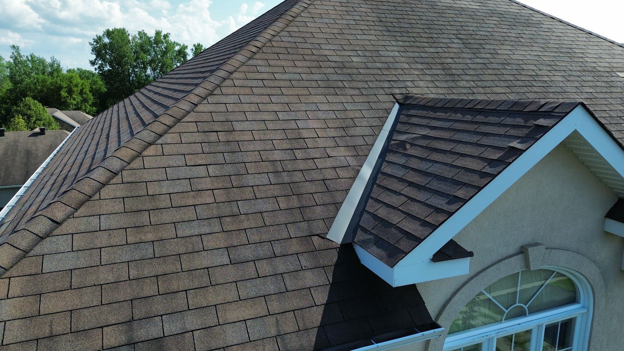 Drone photo showing shingle cupping and lifting texture on a Nepean, Ottawa home's roof